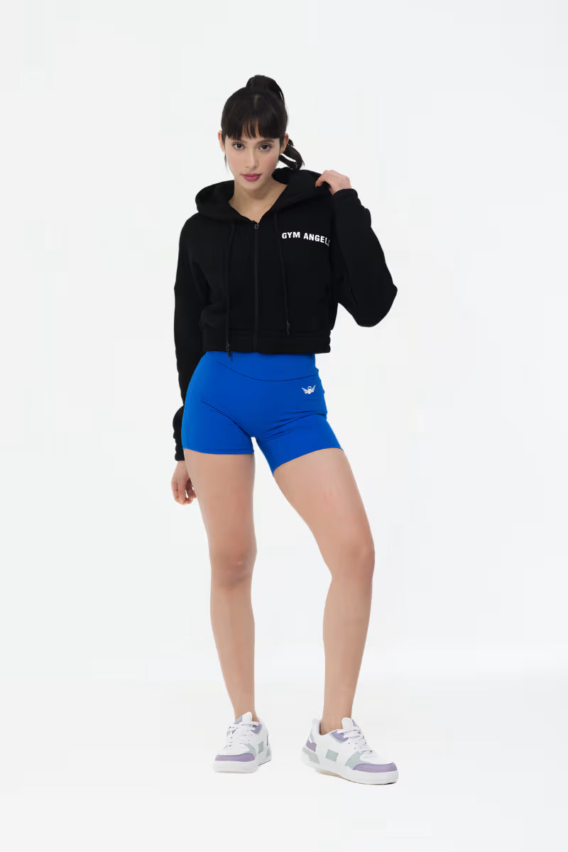 Close-up of black crop fleece hoodie sleeve and fabric texture